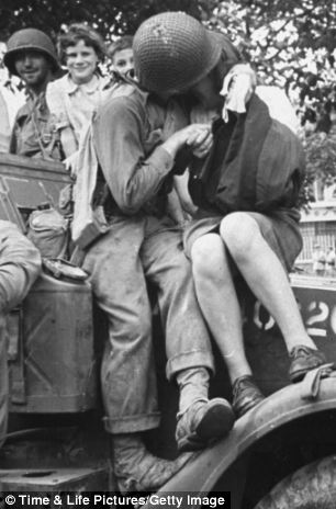 An American GI kisses a French woman somewhere in Normandy. Times/Life Photo